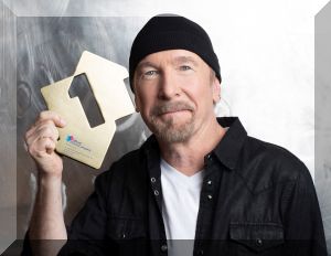 U2’s The Edge poses with his Official Number 1 Album Award for Songs of Surrender from Official Charts Company (credit: Emily Quinn)